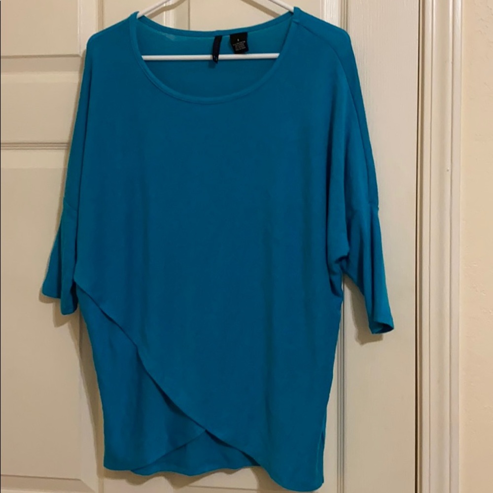 Light teal/turquoise sweater.